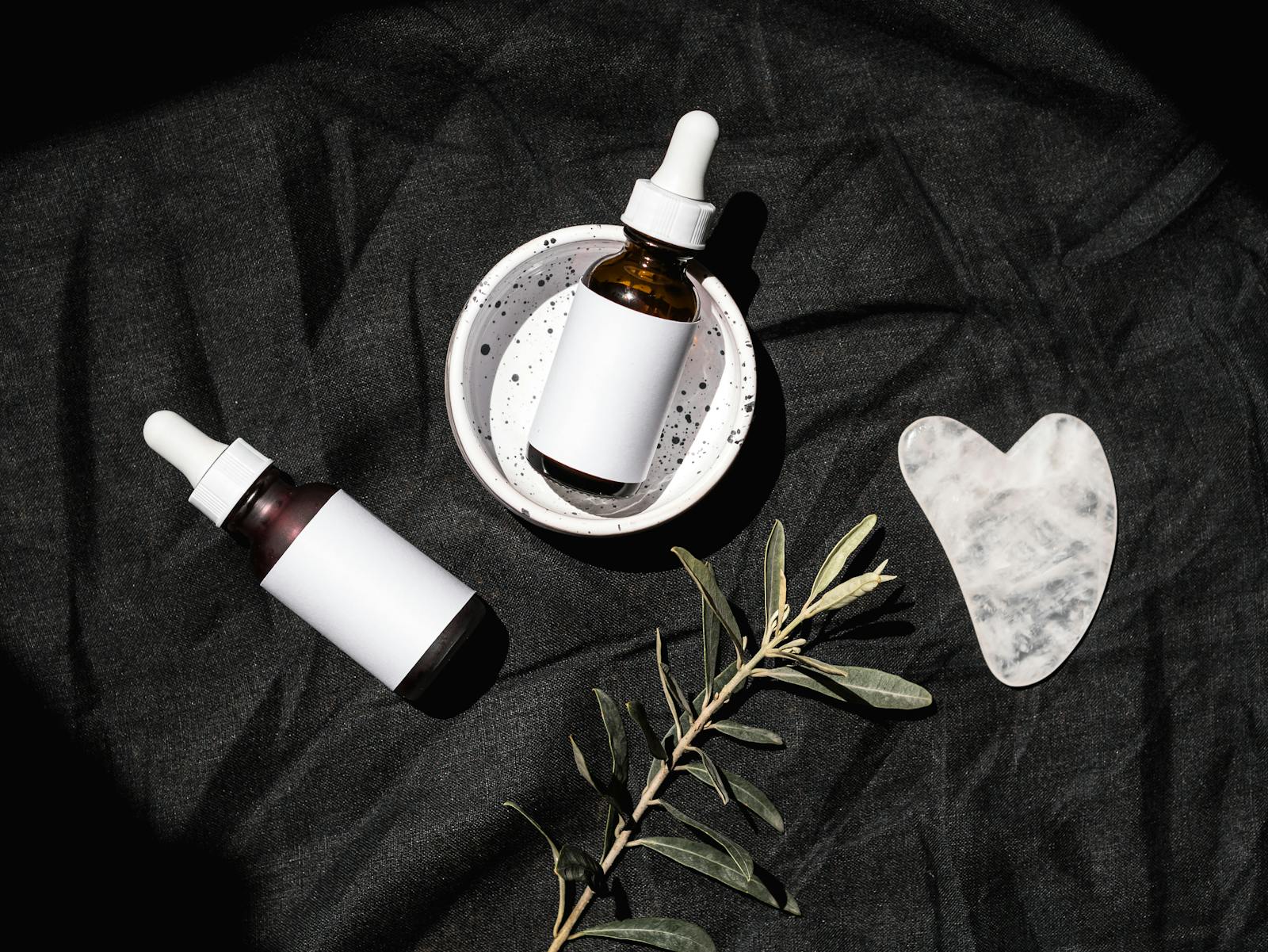 Tretinoin vs retinol — two unbranded skincare serum dropper bottles side by side comparison