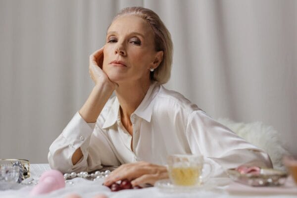 Elegant mature woman representing menopause and vaginal health treatment with Evalon estriol cream