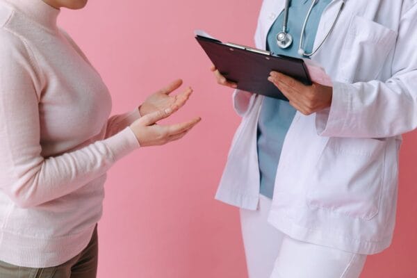 Patient consulting doctor about HCG side effects — what is normal vs when to seek care