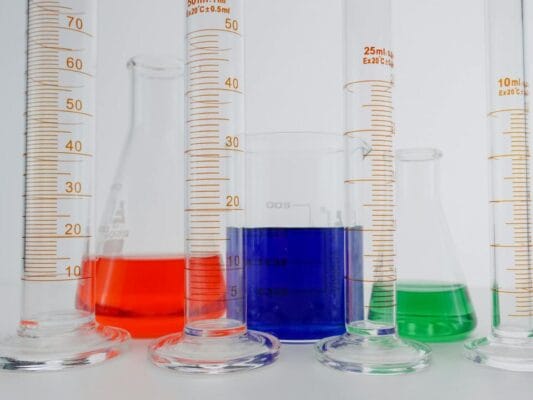 Colorful liquids in laboratory glassware — peptide quality research