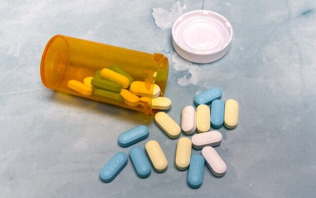 Cholesterol medication pills representing pitavastatin Livalo statin alternatives