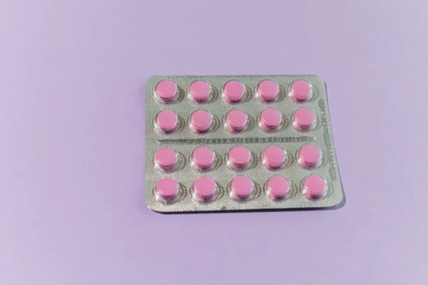 Pink mebeverine tablets in a blister pack for IBS treatment