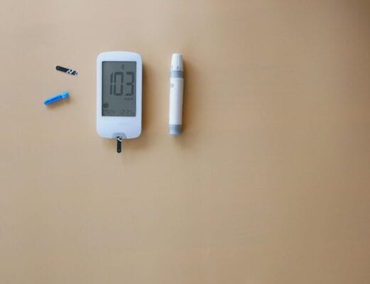 Glucose meter with test strip and lancet — monitoring Type 2 diabetes on Ozempic or Metformin therapy