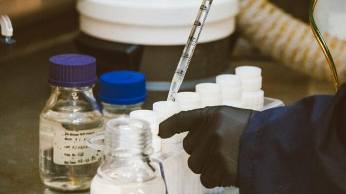 Lab pipette and vials — retatrutide vs tirzepatide GLP-1 peptide research