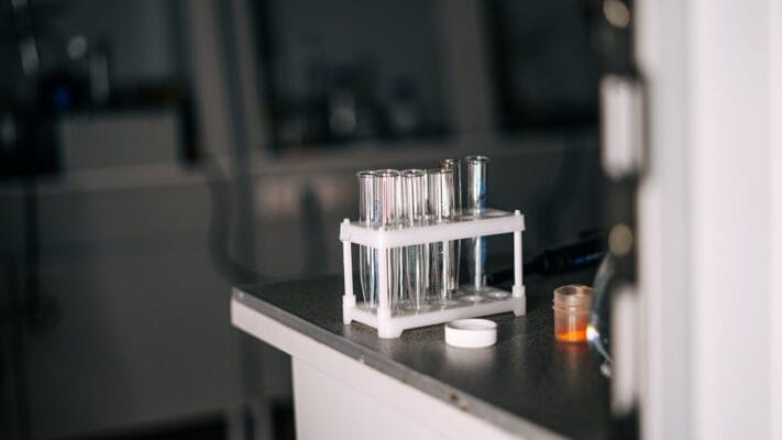 Lab test tubes in rack — quarterly 4-site STI screening for PrEP users